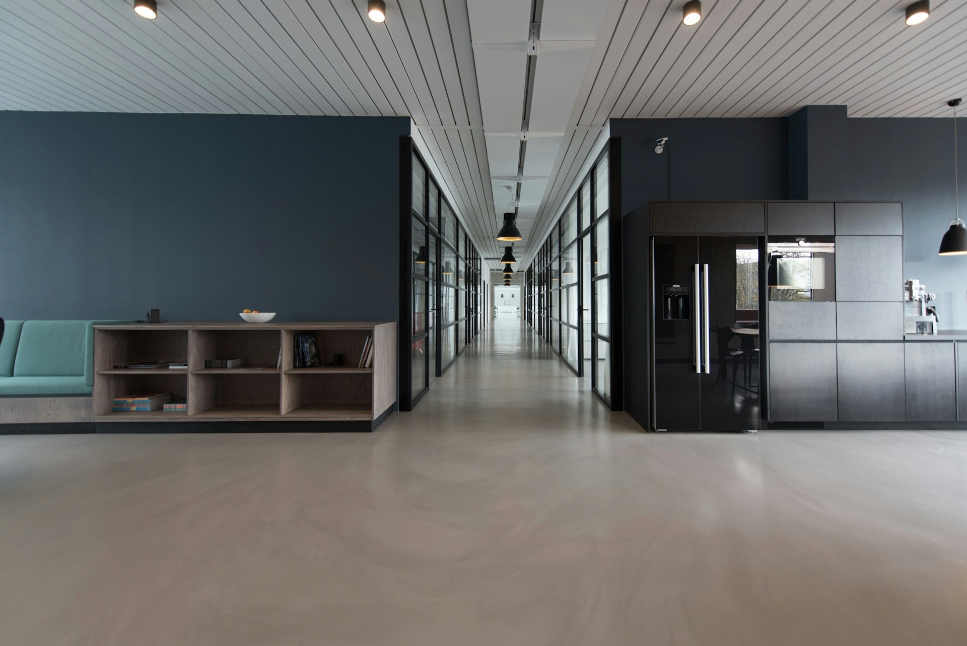A corridor in an arts building with plain walls