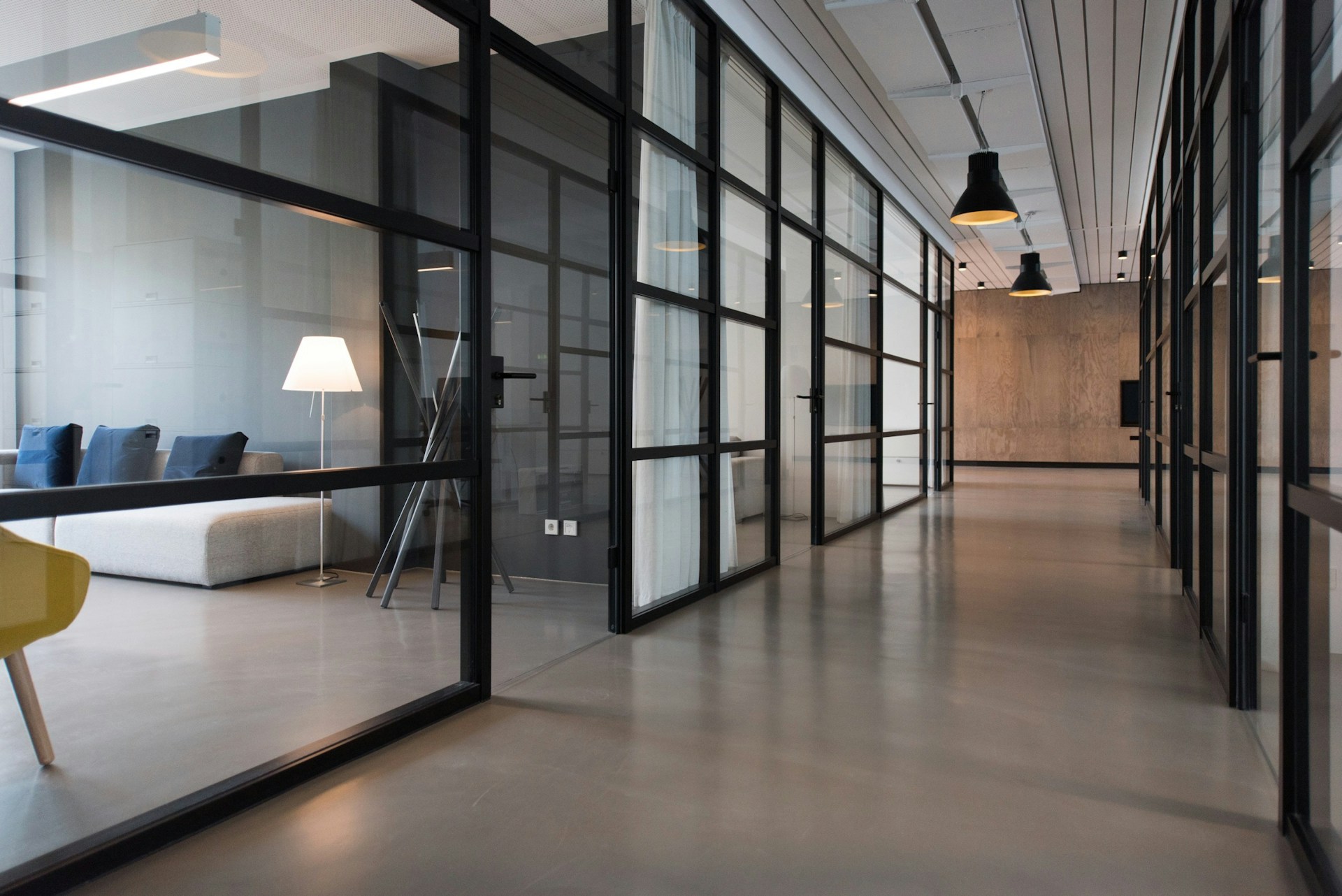 A window with blinds half open onto daylight